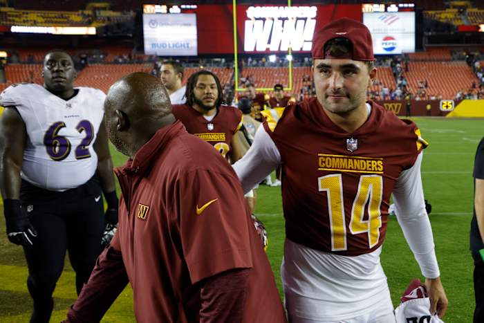 Offensive coordinator Eric Bieniemy (left) and quarterback Sam Howell (right) are building chemistry for the Washington Commanders.
